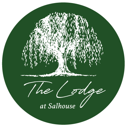 THE LODGE LOGO WHITE ON GREEN CIRCLE